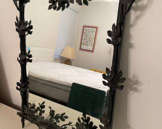 Black steel framed mirror with leaves and branches. Mirror 18”w 23”t Frame 28”w 29”t. $300.00