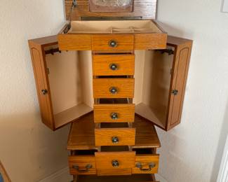 Jewelry Chest  17.25”w 13.25”d 44”t
8 drawers , lid storage & 2 side compartments.  $125.00