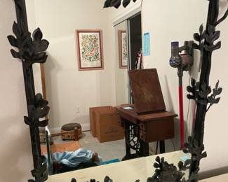 Black steel framed mirror with leaves and branches. Mirror 18”w 23”t Frame 28”w 29”t. $300.00