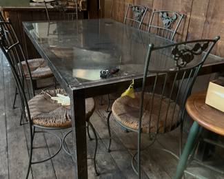 Kitchen Table with six very heavy wrought iron chairs