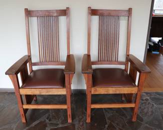 Fantastic pair of mid-century custom wood arm chairs with leather seats. 