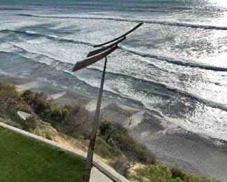 Large sculpture by Laudenslager  - kinetic sculpture.  You can see a larger one on the 5 heading north in Sorrento Valley - in front of Ruth’s Chris