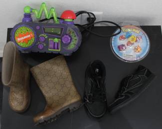 Nickelodeon clock $60 (working condition), vintage pokemon rings from the 90s $20, Gucci rain boots for kids $80 and Jordan 1 Travis Scott Phantom $120