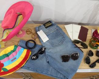 Yves Saint Laurent Floppy Hat $300, Gucci Denim Pants New with tags $250, Moschino bucket hat $75, Designer sunglasses $50-$125, Cartier check holder $75, Givenchy Bangle $125
