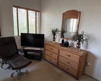 Wicker dresser and mirror with wood accents.