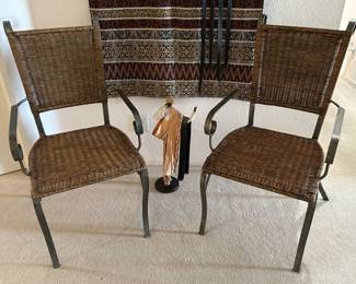 Wicker and metal arm chairs.