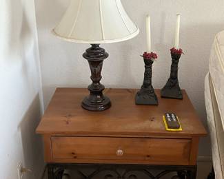 Unique wood and metal nightstands.