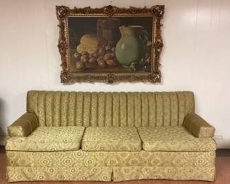 MID CENTURY THREE SEATER SOFA IN OLIVE GREEN. 