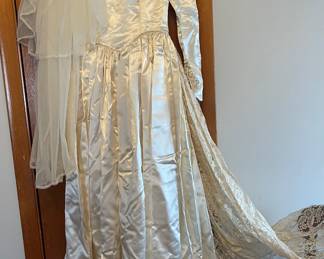 One of a kind vintage satin and lace wedding gown and hairpiece. 