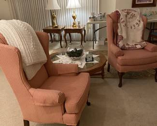 Two beautiful mauve wing back chairs in pristine condition.  Notice the Barberton afghan that is also available AND the two beautiful Stiffel lamps in the window