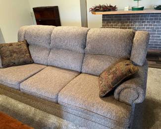 Neutral toned, three section couch with pillows 36 x 84 x 40 Located in the basement