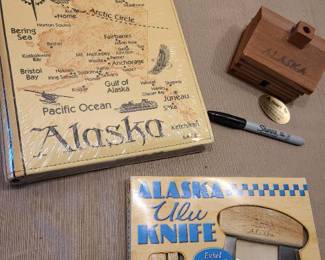 Alaska Ulu knife with stand, small Alaska wooden cabin with incense inside, Alaska photo album