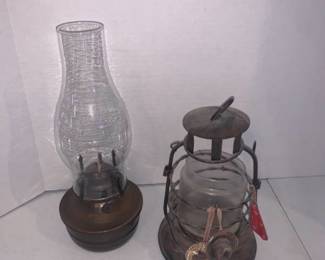 An oil lamp and candle holder lantern. Tallest is 12 inches