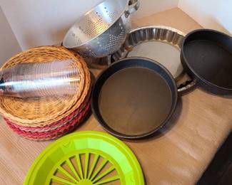 Plastic and wicker paper plate holders, colander, cake pans.