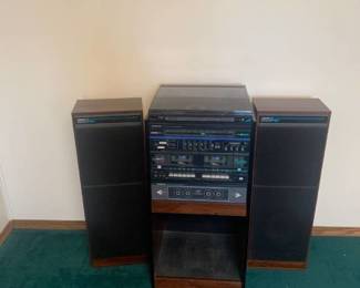Soundesign AM FM receiver with double deck cassette player and record player with speakers. Stereo is 33 x 16 x 13.5. Speakers are 31 x 11 x 8. Located in the basement Radio does work