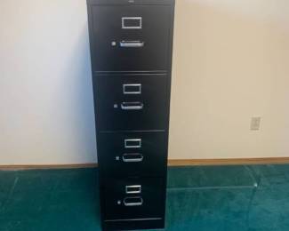 4 drawer black metal filing cabinet. 52 x 15 x 25. Located in the basement
