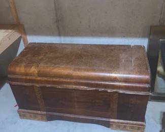 Cedar chest. Top needs repair. Approximately 24 x 45 x 19. Located in the basement