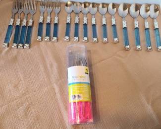 Plastic and stainless flatware. Pink set never opened, blue set incomplete