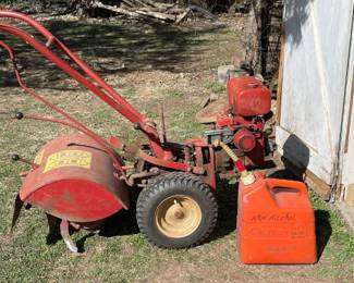 Troy Bilt roto tiller with 5 gallon gas can