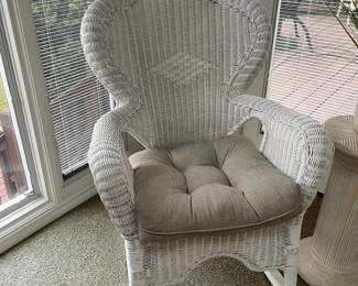 . . . white wicker rocking chair