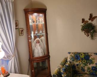 Floral  couch sold..Display cabinet and Handmade Bridal  dress on doll is for sale
