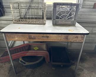Metal table, crates, oil pans and ramps