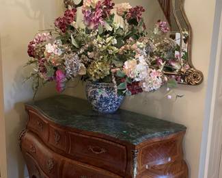 Marble topped credenza 56" w x 26" deep x 36" high with Venetian mirror and blue delft vase with floral arrangement