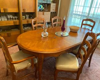 Light oak table with 6 padded chairs