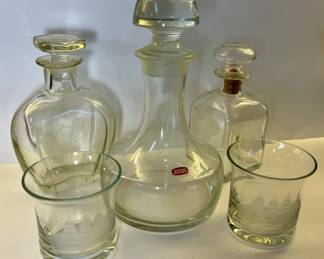 Svend Jensen decanter, 2 other decanters, 2 crystal etched with ship glasses