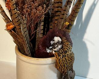 Stoneware crock with dry flowers and pheasant feathers 