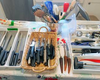 Lots of utensils and kitchen knives