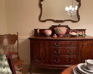 GORGEOUS buffet and mirror!  Check out that Roseville pottery.  