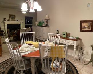 Lovely dining table, 4 chairs, liquor cabinet, and side table.