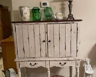 liquor cabinet - left side holds wine bottles, right side holds liquor bottles.  Come check it out!