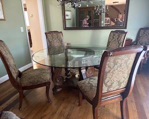 Gorgeous dining table with round glass top and matching chairs 