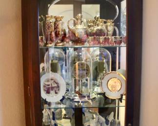 Tall wood display case with glass shelves 