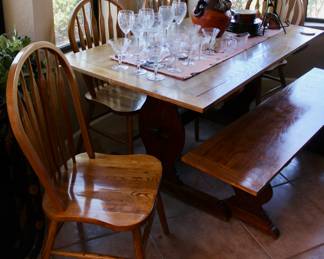Wood dining table with four chairs and bench seat