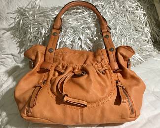 Women's leather purse. Lots of designer purses.