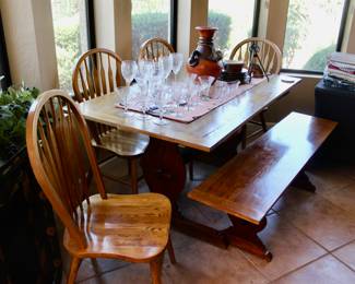 Wonderful trestle wood dining table with four chairs and bench seat