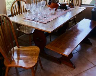 Wood dining table with four chairs and bench seat