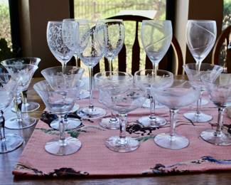 Various sets of decorative wine glasses and drinking glasses