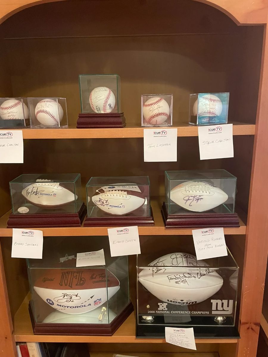 Signed baseball and footballs by famous players.