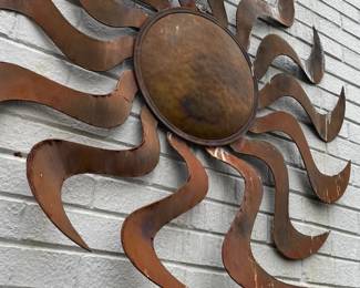 Copper sun sculpture.