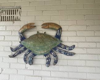 Metal blue crab sculpture.