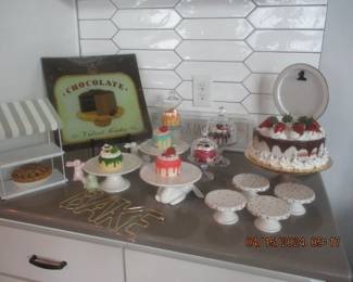 Artificial cupcakes and cake with assorted cake stands