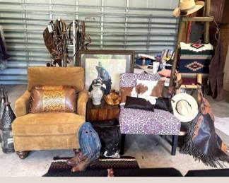Suede fabric arm chair, vintage cowboy boots, purple print side chair, cowboy print, cow hide pillows, saddle blankets, leather chaps and more