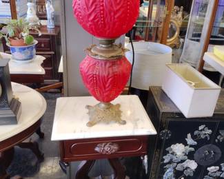 Red Satin Glass gone with the wind lamp. Original On marble top table.