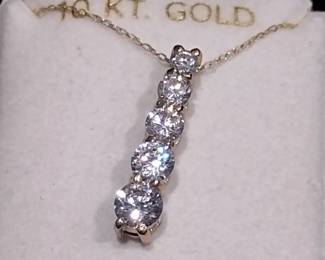 10 karat gold necklace and pendant.