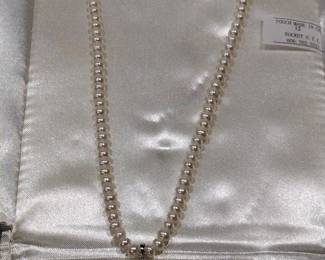 Large Pearl necklace.