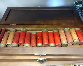 Paper shotgun shells in collectors box.